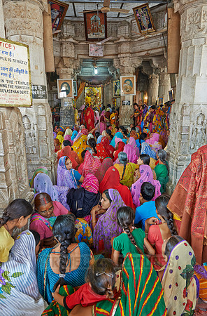 colorful hindu women during ceremony