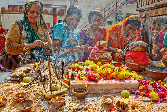 colorful hindu women during ceremony