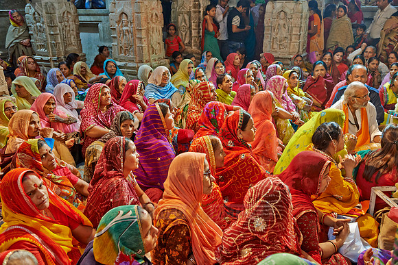 colorful hindu women during ceremony