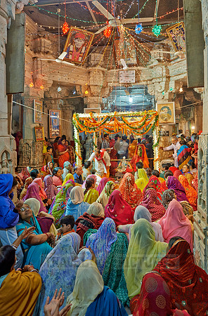 colorful hindu women during ceremony