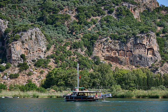 Tourist ship in front of Lycian rock tombs