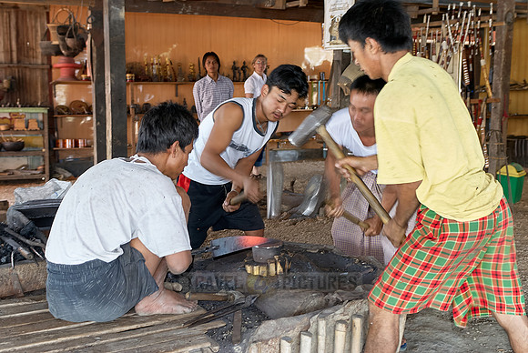blacksmith beating iron