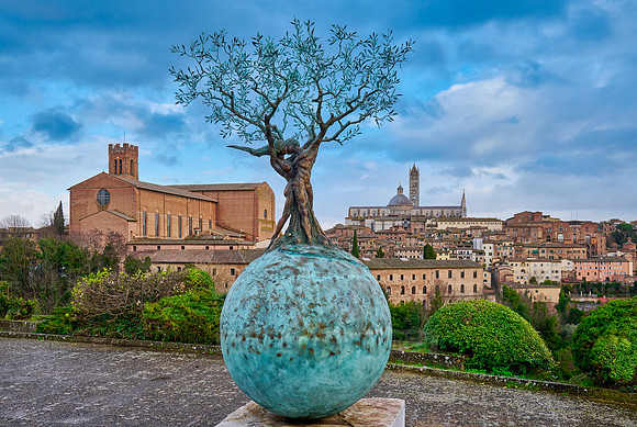 sculpture in front of Siena with Cathedral and Basilica Cateriniana di San Domenico
