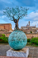sculpture in front of Siena with Cathedral and Basilica Cateriniana di San Domenico