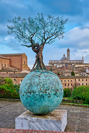 sculpture in front of Siena with Cathedral and Basilica Cateriniana di San Domenico