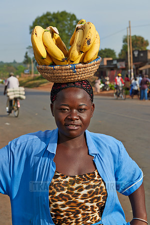 Ugandan woman with Bananas on head