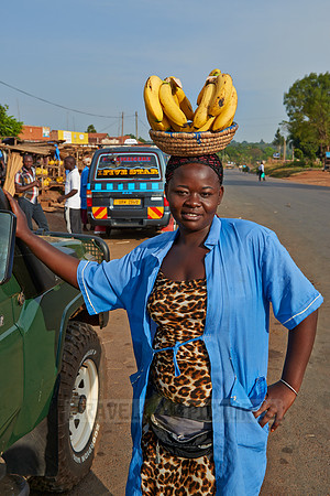 Ugandan woman with Bananas on head