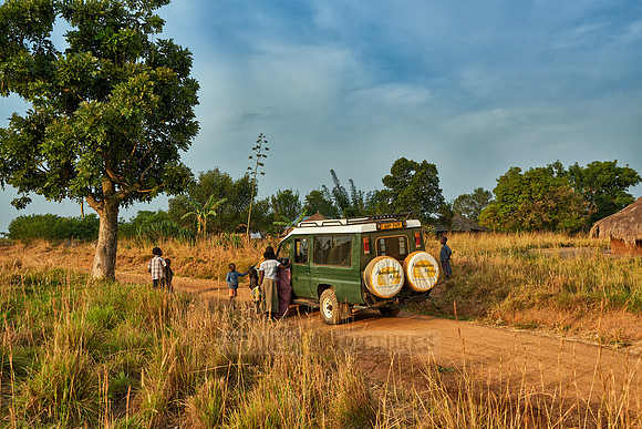 locals around 4x4 in village