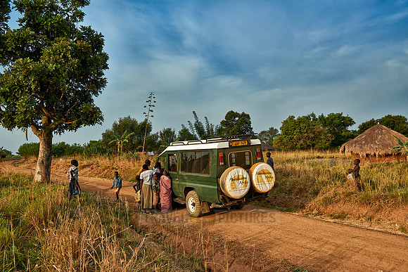 locals around 4x4 in village