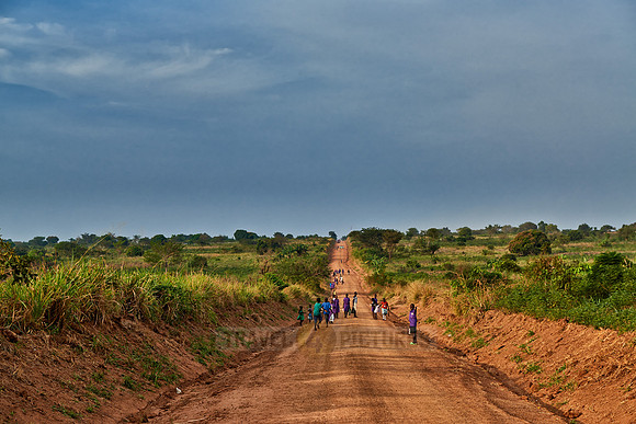pedestrians on gravel road