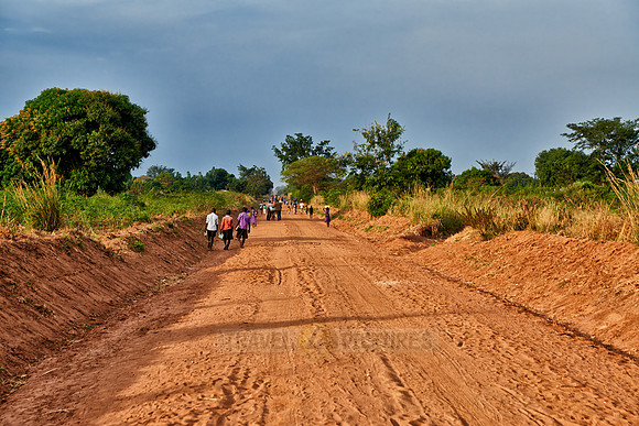 pedestrians on gravel road