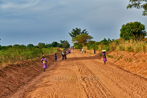 pedestrians on gravel road