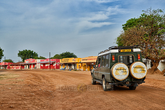 4x4 on  gravel road in village