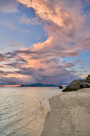 Cloud towers over Praslin in the evening seen from Anse Source D'Argent