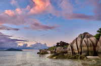 Cloud towers over Praslin in the evening seen from Anse Source D'Argent