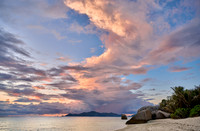 Cloud towers over Praslin in the evening seen from Anse Source D'Argent