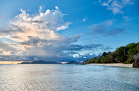 Cloud towers over Praslin in the evening seen from Anse Source D'Argent