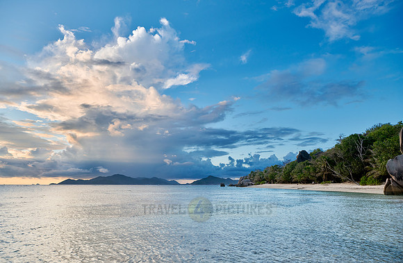 Cloud towers over Praslin in the evening seen from Anse Source D'Argent