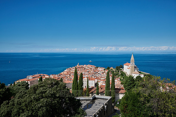 View from above onto Piran with the Mediterranean Sea behind