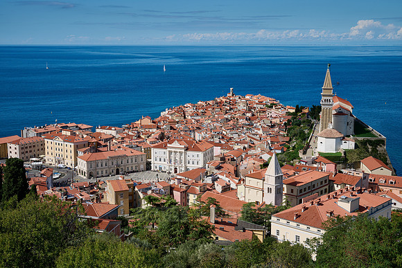 View from above onto Piran with the Mediterranean Sea behind