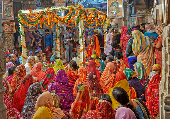 colorful hindu women during ceremony