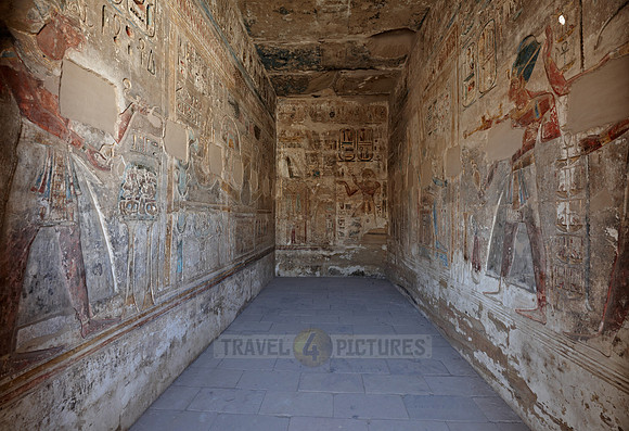room with colorful bas-reliefs beside column hall