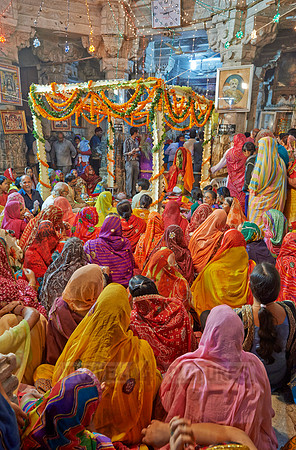 colorful hindu women during ceremony