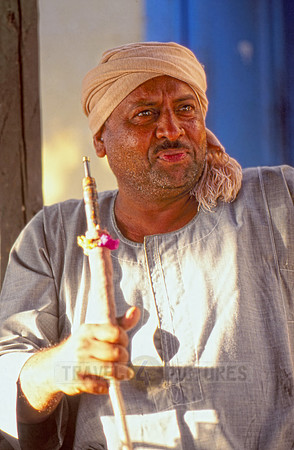 Egyptian man with typical clothes smoking shisha