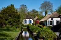 canal and traditional house in dutch Giethoorn village
