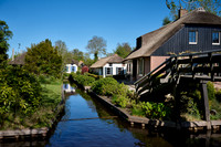 canal and traditional house in dutch Giethoorn village