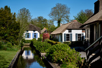 canal and traditional house in dutch Giethoorn village