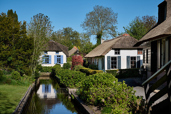 canal and traditional house in dutch Giethoorn village