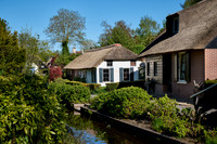 canal and traditional house in dutch Giethoorn village