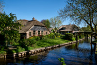 canal and traditional house in dutch Giethoorn village