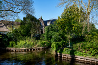 canal and traditional house in dutch Giethoorn village