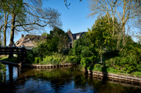 canal and traditional house in dutch Giethoorn village