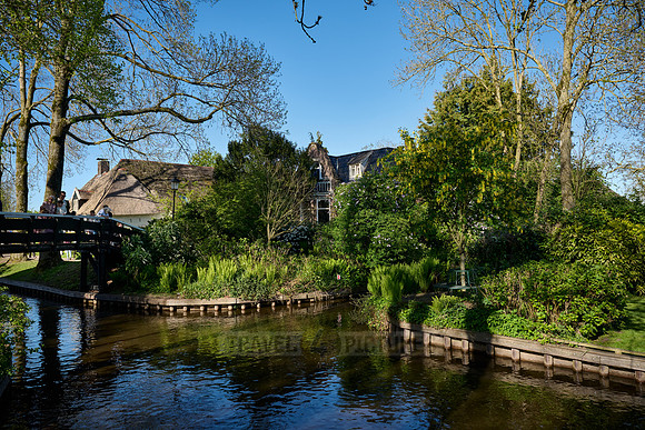 canal and traditional house in dutch Giethoorn village