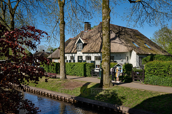 canal and traditional house in dutch Giethoorn village