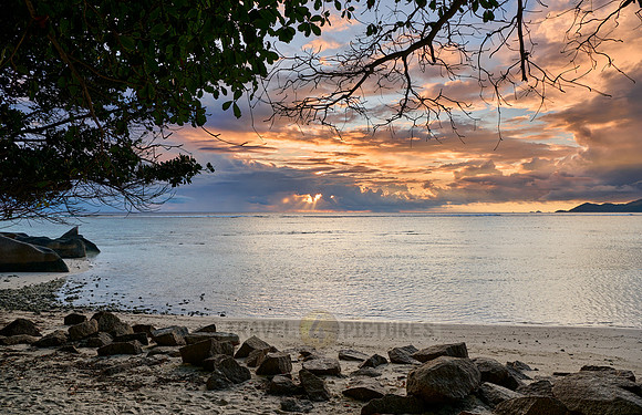 Sunset over the sea from the Anse Source D'Argent