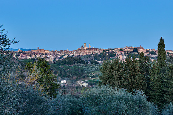 view on illuminated Siena from a distance