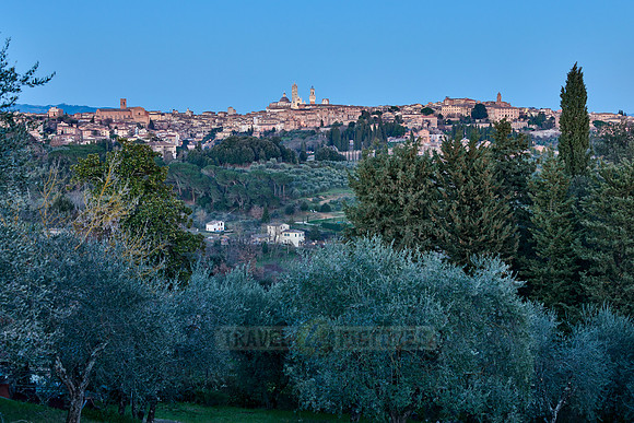 view on illuminated Siena from a distance