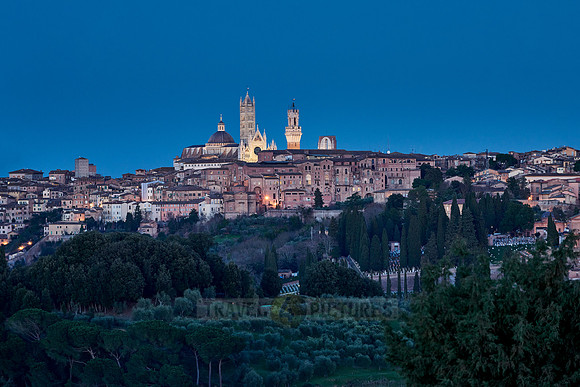 view on illuminated Siena from a distance