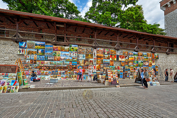 stalls with paintings at city wall