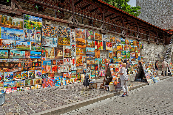 stalls with paintings at city wall