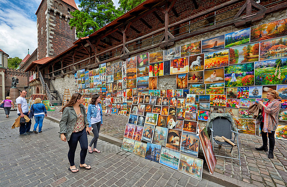 stalls with paintings at city wall