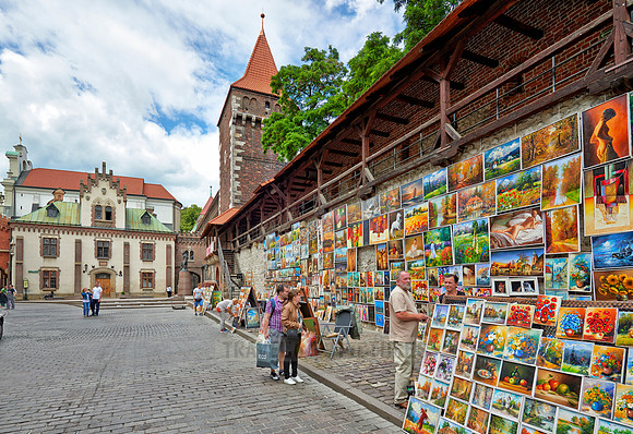stalls with paintings at city wall