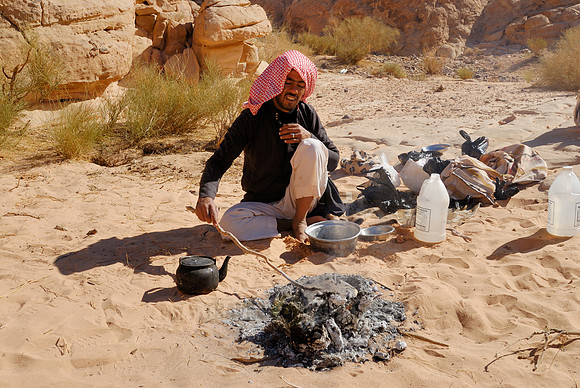 Bedouin baking bread  in Wadi Rum