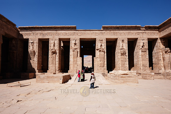 Columns of god Osiris at western colonade in second yard