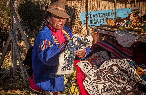 Indigena of local Uros tribe on floating reed islands