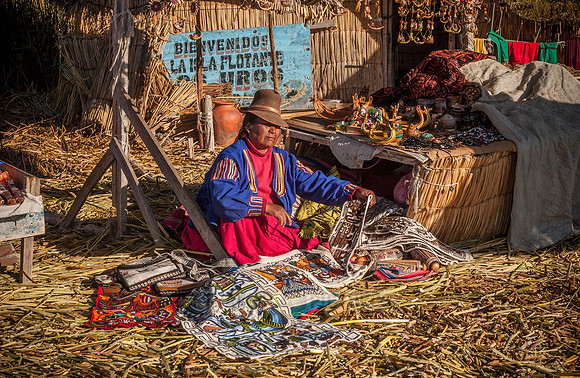 Indigena of local Uros tribe on floating reed islands